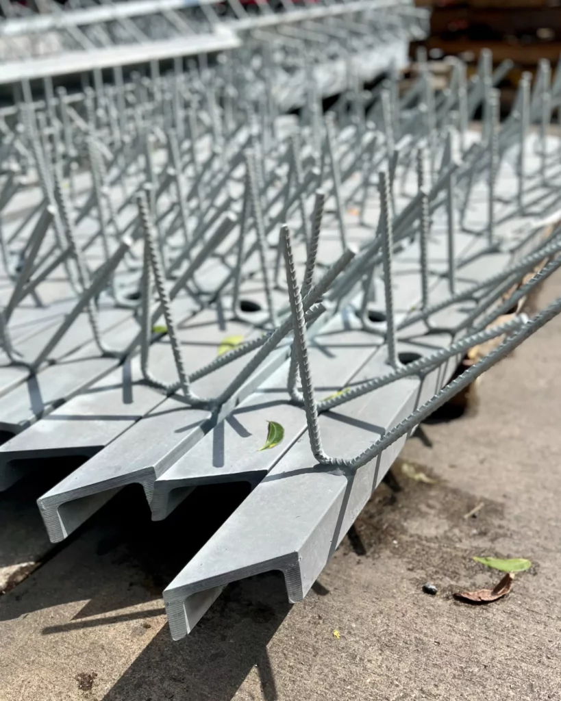 Galvanized steel embed channels with welded rebar hairpin anchors.